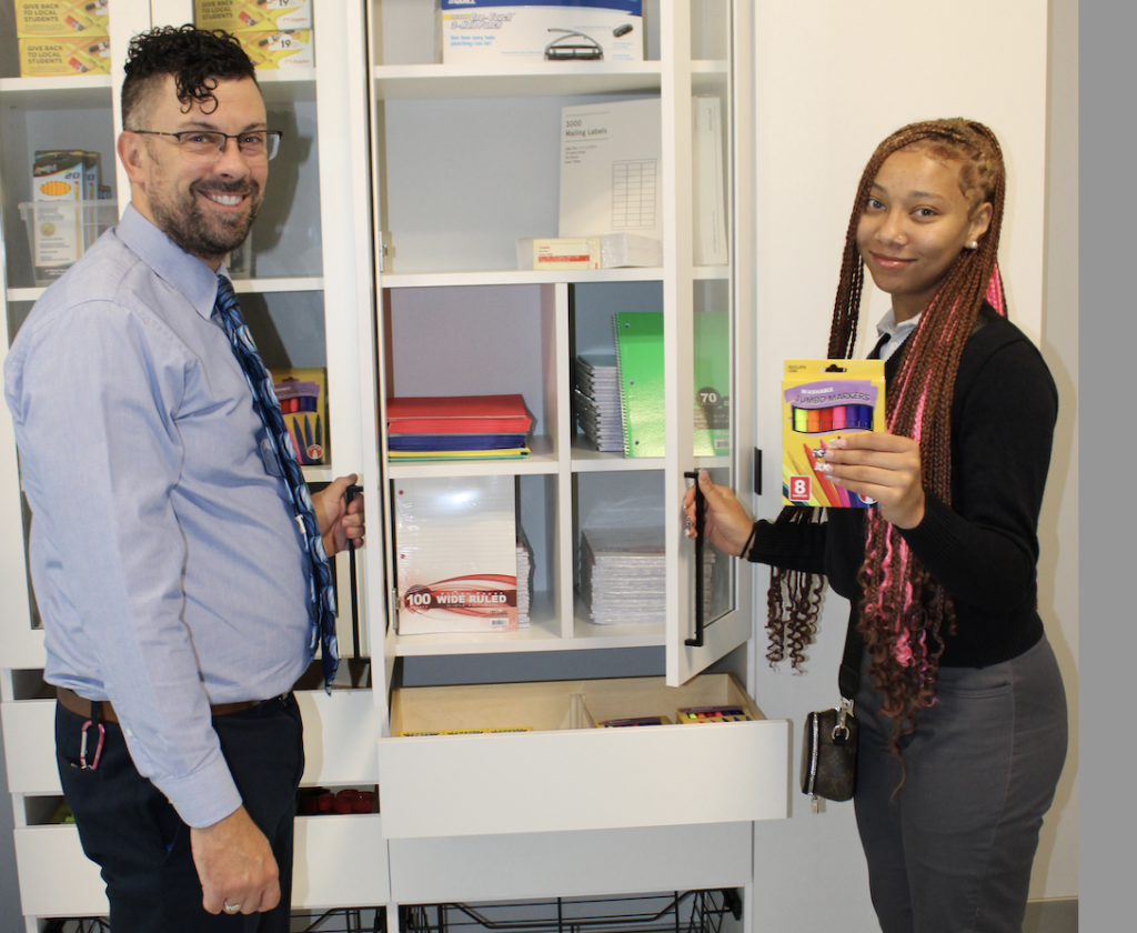 Pictured at DPCR’s Hubbard’s Cupboard are teacher Daniel Verdon and Niyla, a junior at the school.